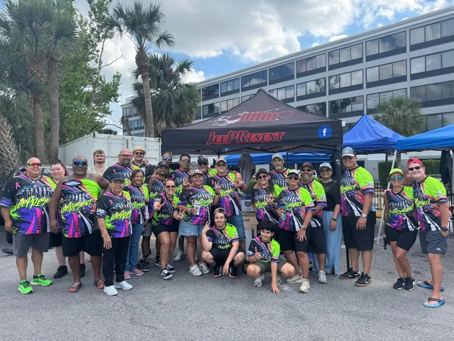JeePResent club members in matching jerseys at their Go Topless Day tent. Photo: JeePResent (@jeepresent_fl)