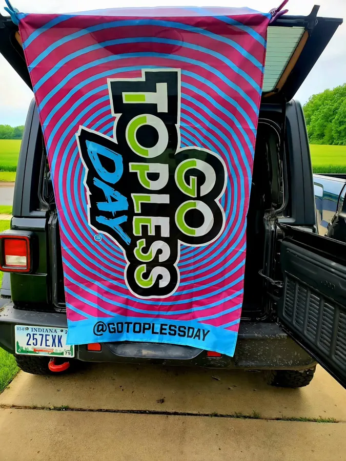 Go Topless Day towel hanging from the back of a Jeep. Photo: Twin Lakes Social Jeep Club (@burkie_burkhalter)